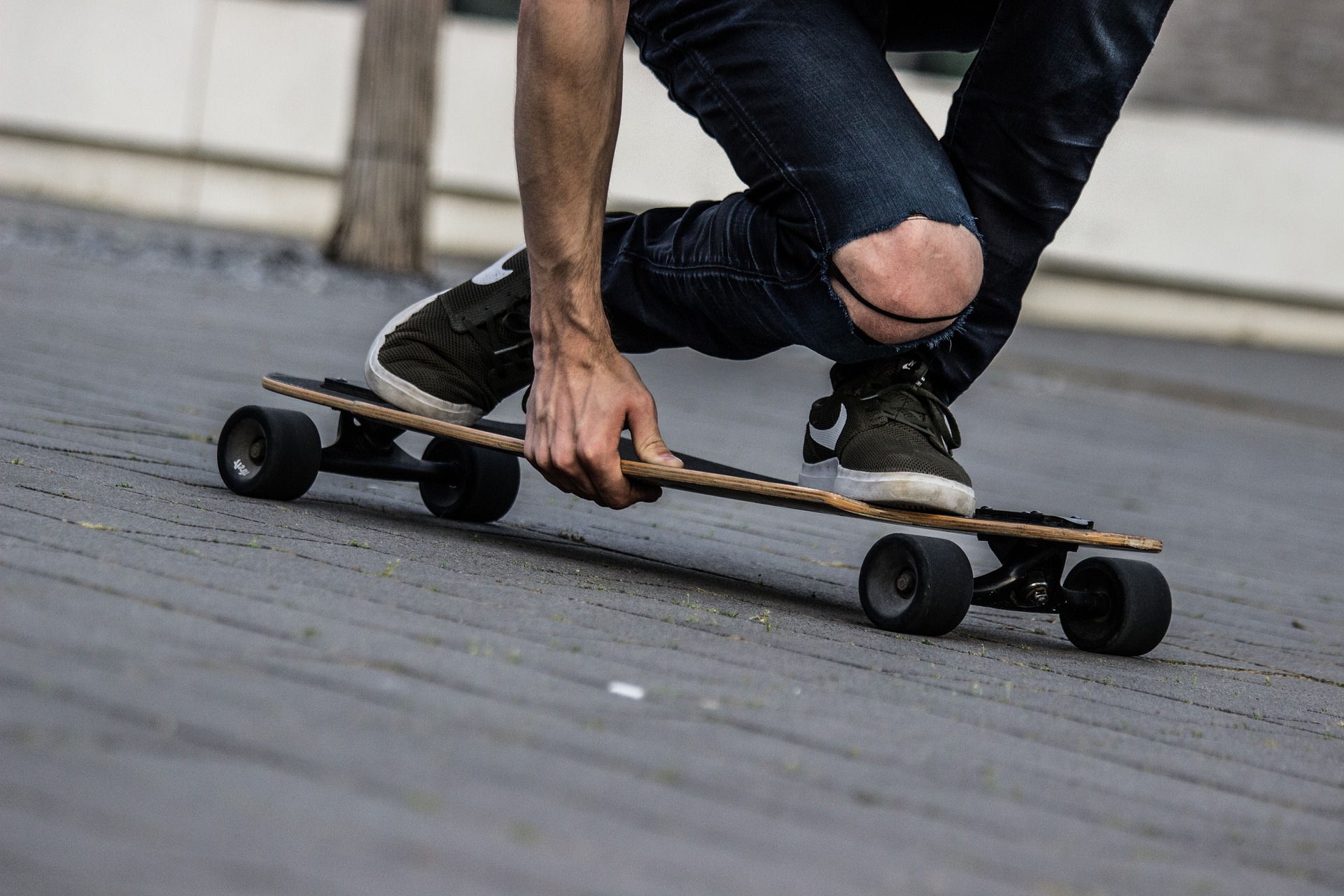a guy crusing on a longboard