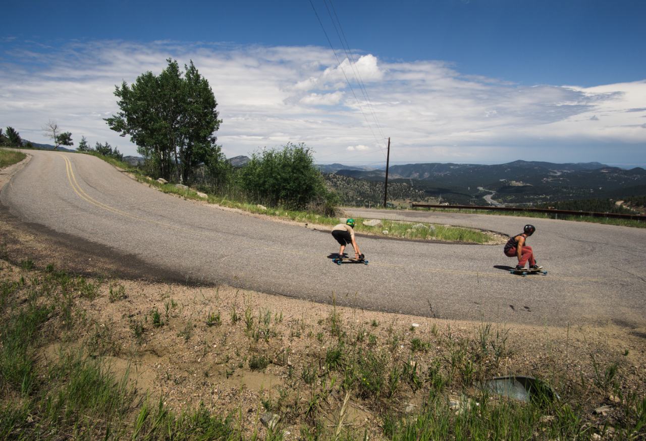 2 men downhill longboarding