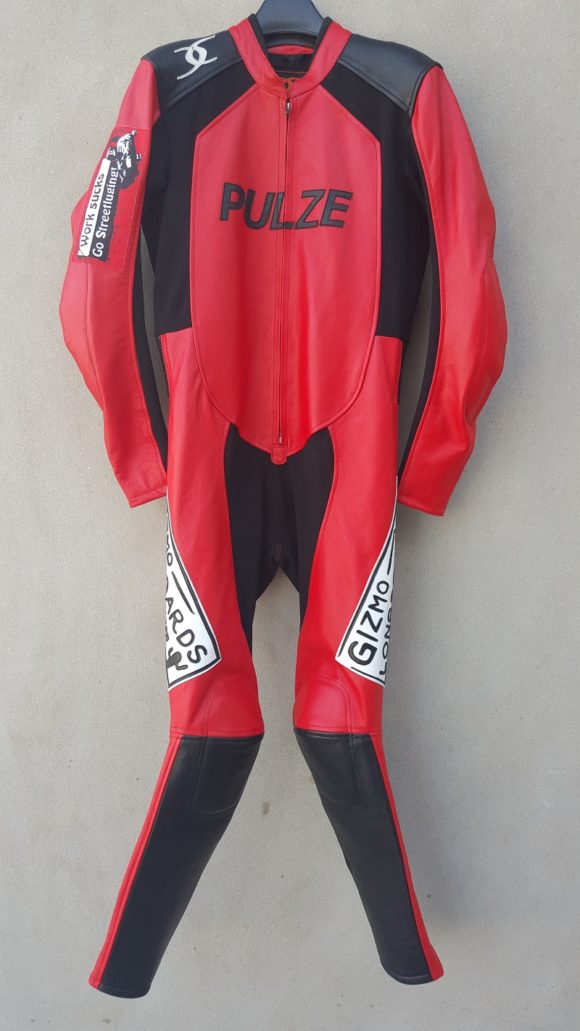 Red and black downhill racing suit with Gizmo company labels