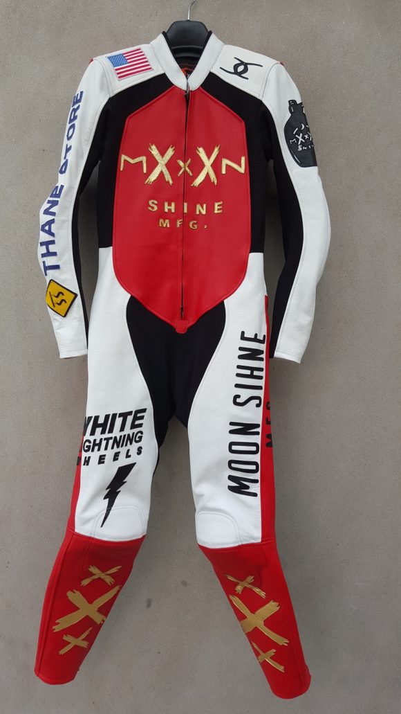 Red, black and white racing suit called white lightning