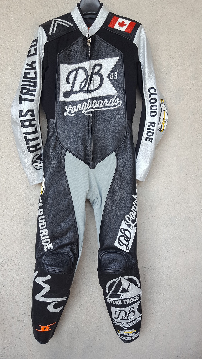 Gray and sliver racing suit with the Candian flag on the left shoulder and DB longboard logo in the middle of the suit