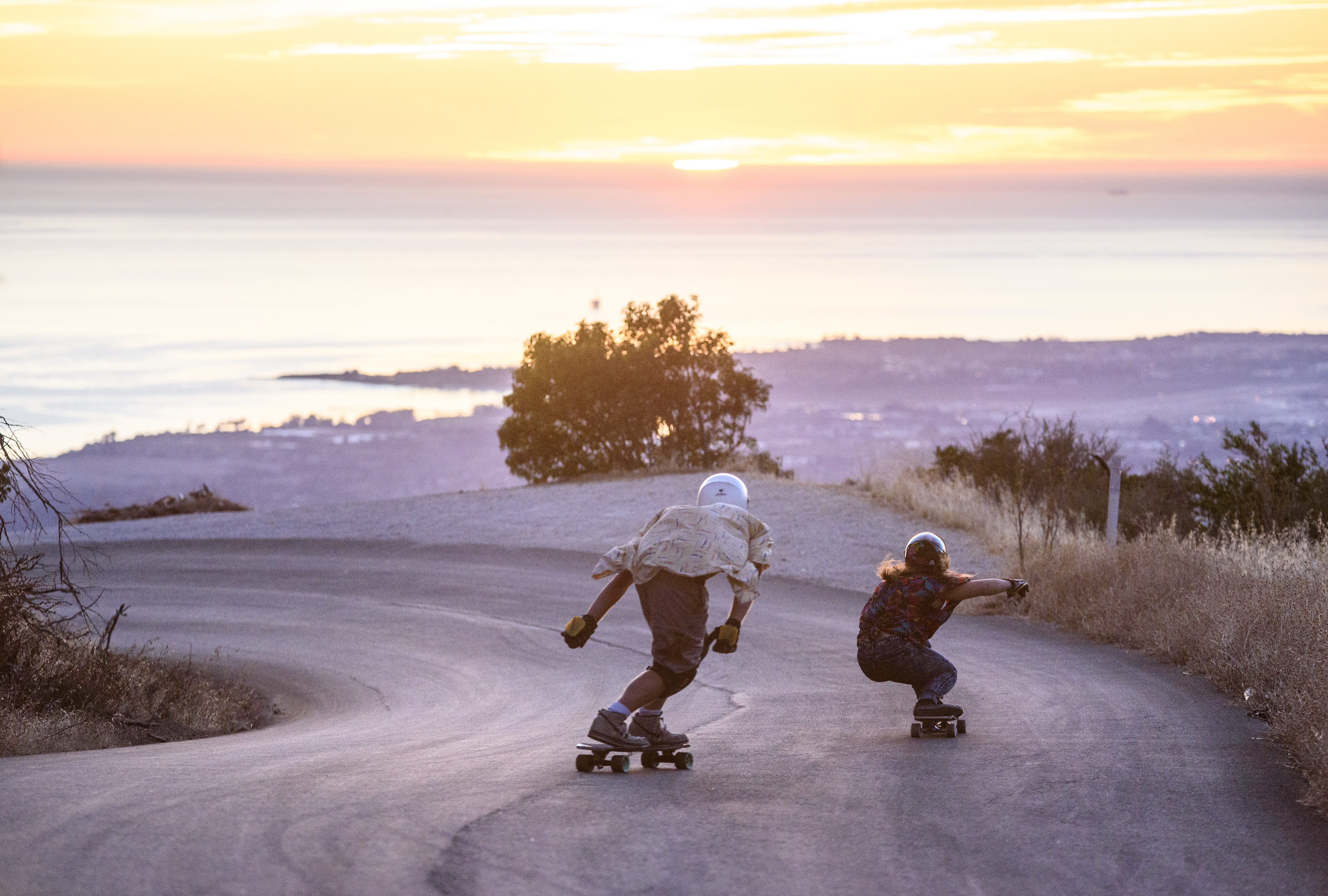 2 guys riding down a hill